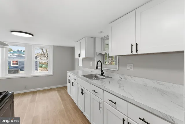 a kitchen with a sink and cabinets