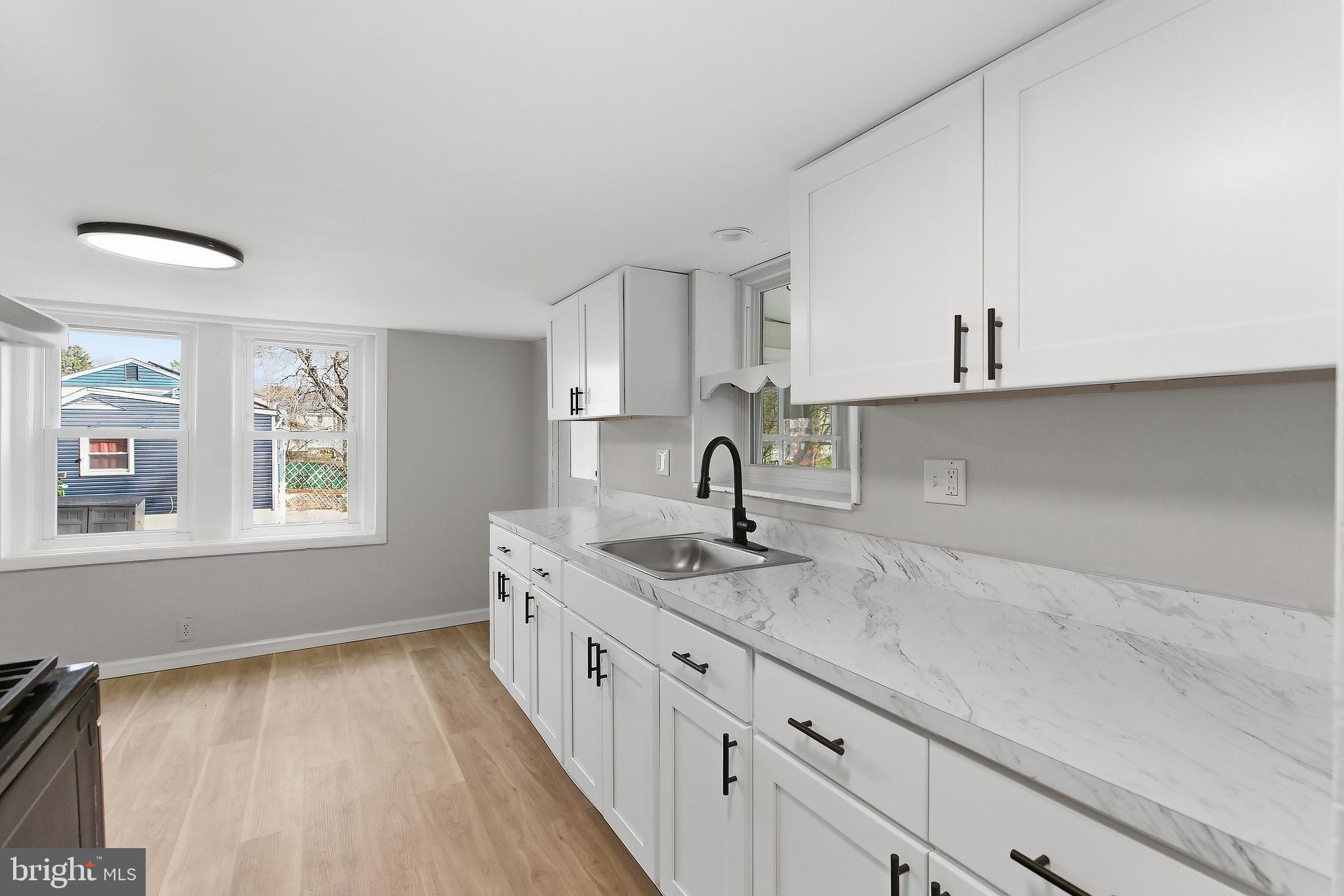 409 Cedar Avenue Lindenwold, NJ 08021 - Photo 11 of 25 a kitchen with a sink and cabinets