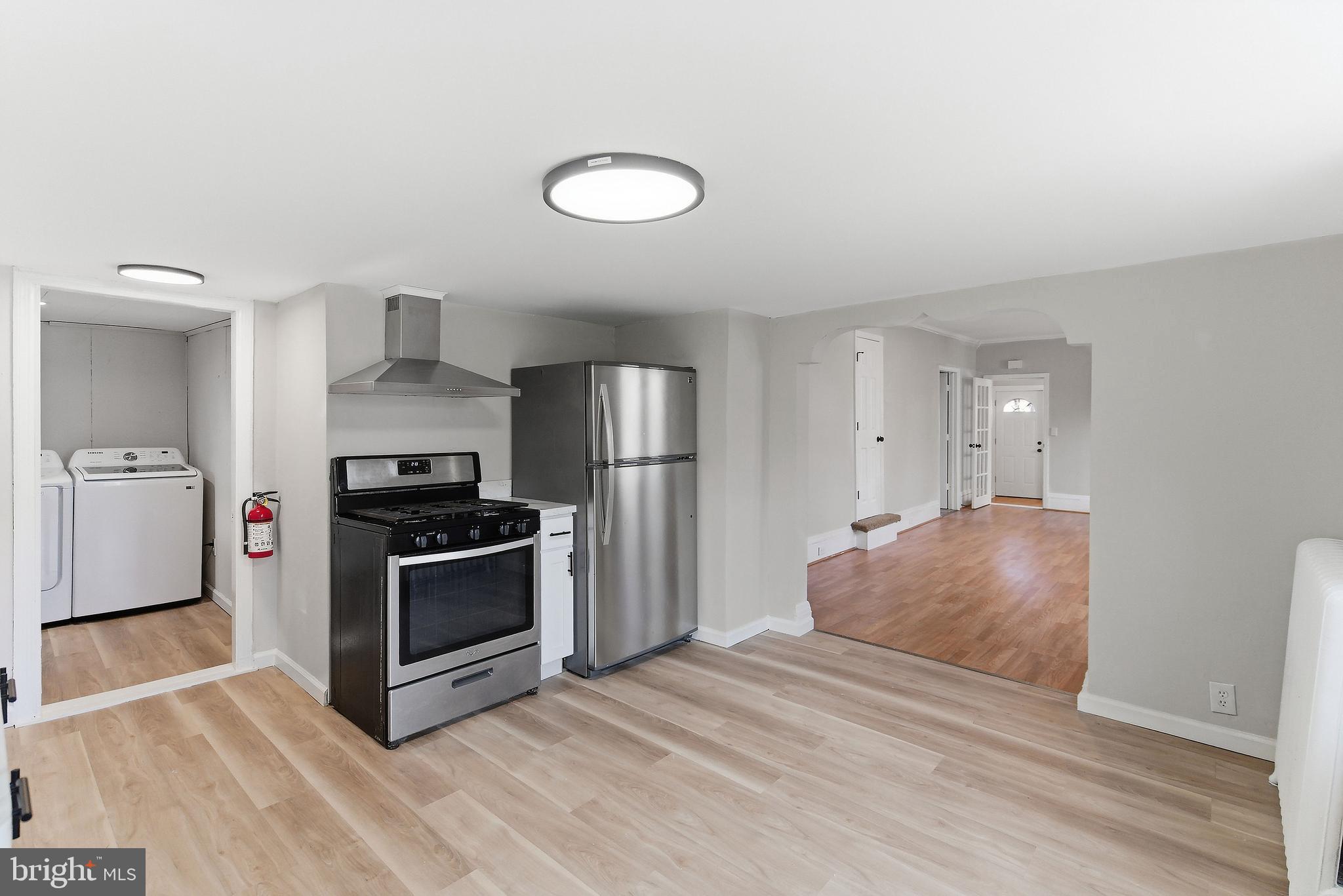 409 Cedar Avenue Lindenwold, NJ 08021 - Photo 12 of 25 a kitchen with stainless steel appliances granite countertop a sink and a refrigerator