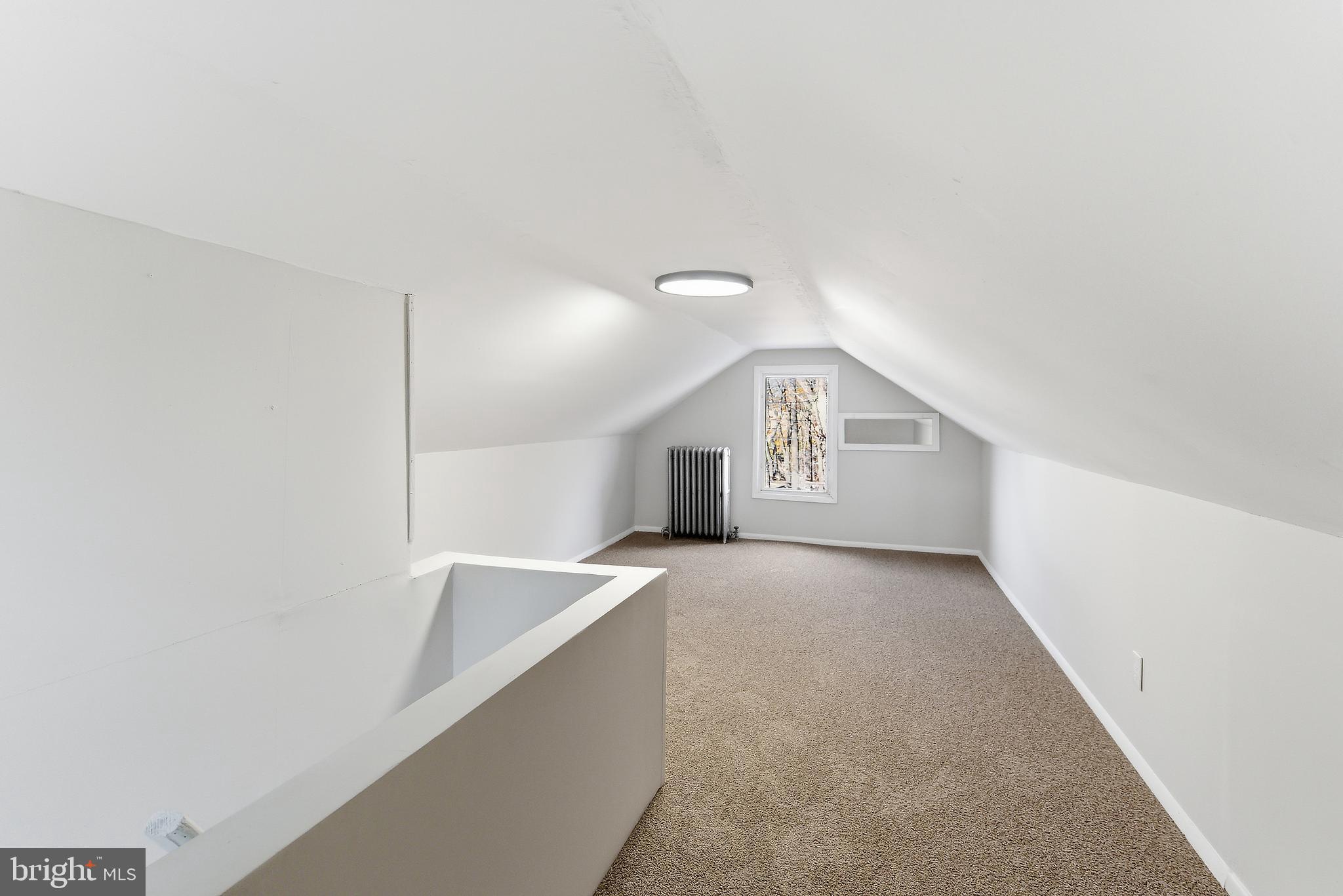 409 Cedar Avenue Lindenwold, NJ 08021 - Photo 20 of 25 a view of an empty room with window and wooden floor
