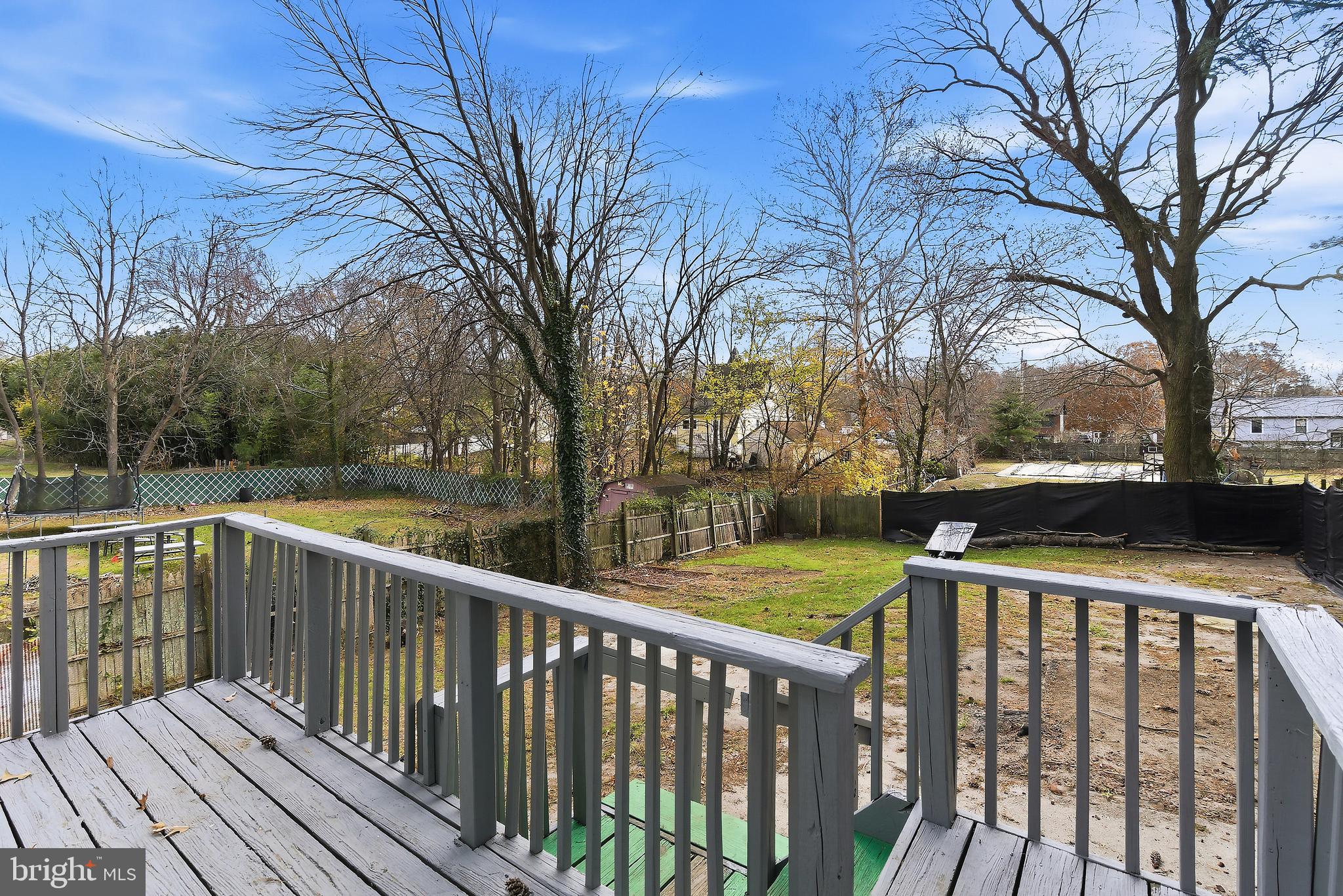 409 Cedar Avenue Lindenwold, NJ 08021 - Photo 2 of 25 a view of deck and a yard with wooden fence