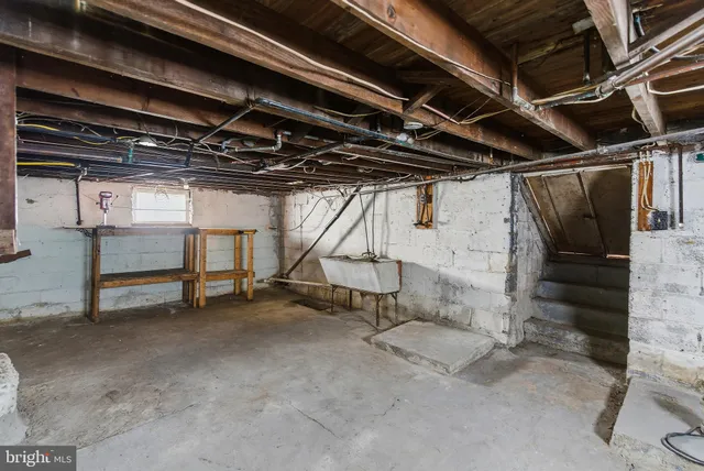 a view of empty room with wooden walls