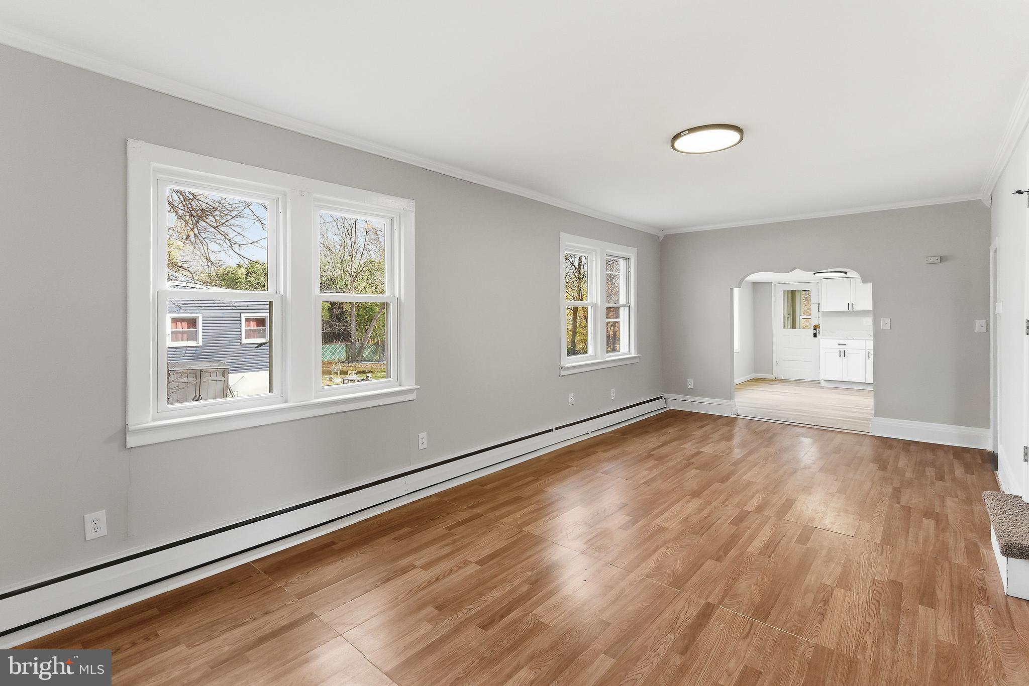 409 Cedar Avenue Lindenwold, NJ 08021 - Photo 7 of 25 a view of empty room with wooden floor and fan