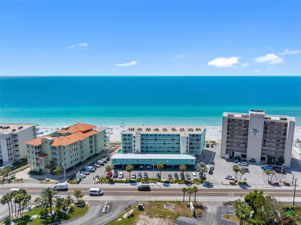 19440 Gulf Boulevard, Unit 506 Indian Rocks Beach, FL 33785 - Photo 20 of 67 a view of building with outdoor space and ocean view