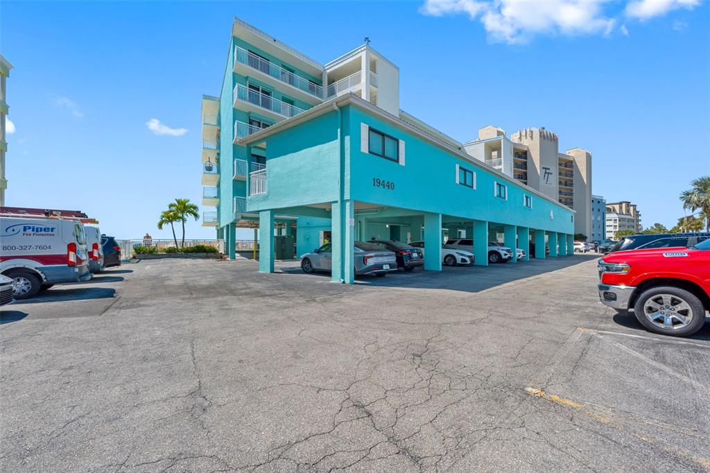 19440 Gulf Boulevard, Unit 506 Indian Rocks Beach, FL 33785 - Photo 47 of 67 a car parked in front of a building