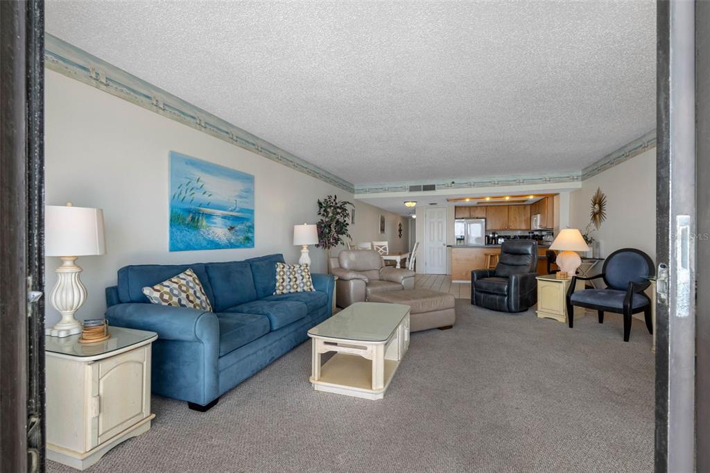 19440 Gulf Boulevard, Unit 506 Indian Rocks Beach, FL 33785 - Photo 50 of 67 a living room with furniture and a large window