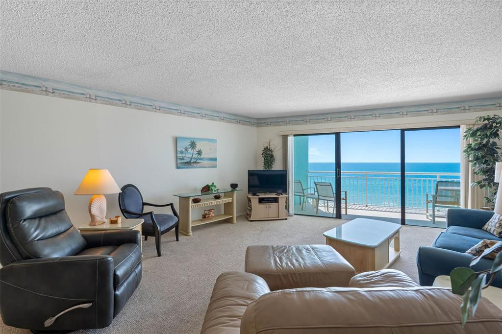 19440 Gulf Boulevard, Unit 506 Indian Rocks Beach, FL 33785 - Photo 5 of 67 a living room with furniture and a large window