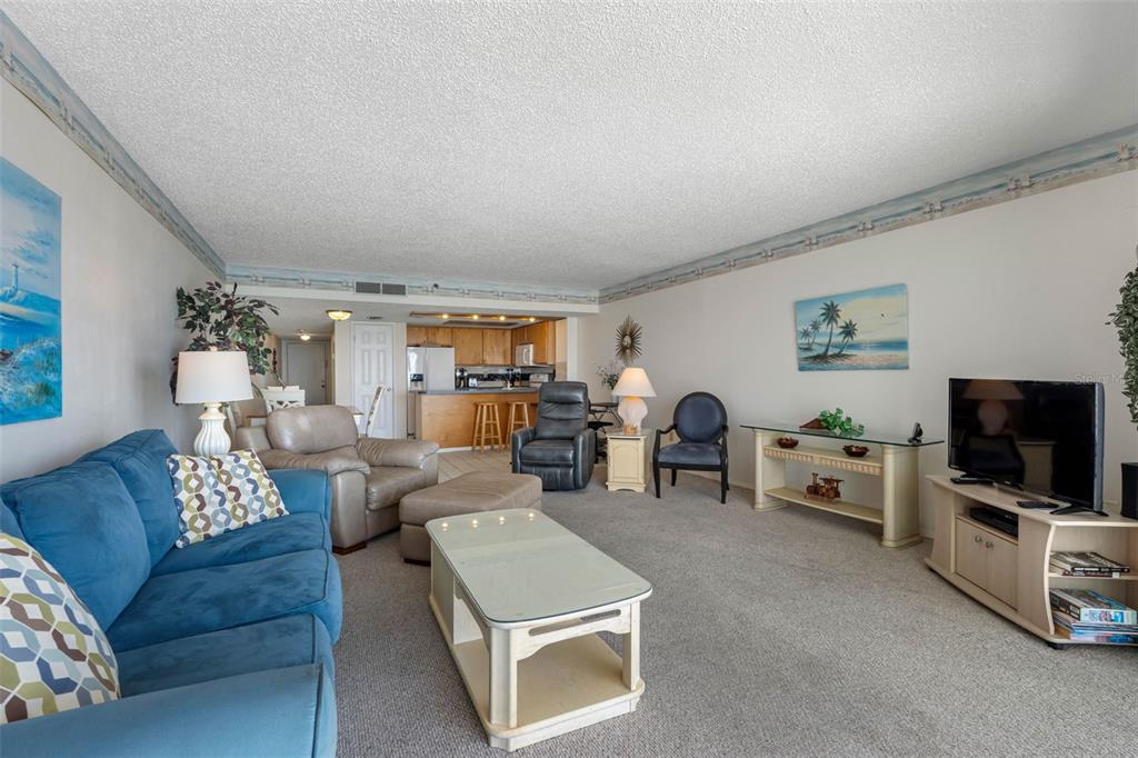19440 Gulf Boulevard, Unit 506 Indian Rocks Beach, FL 33785 - Photo 51 of 67 a living room with furniture and a flat screen tv