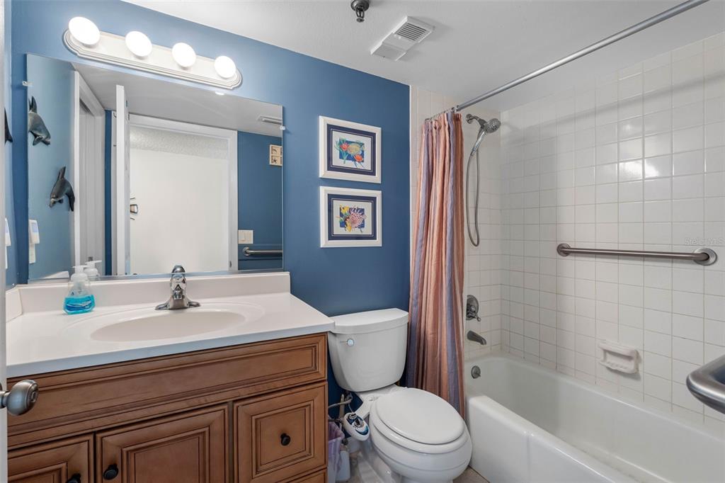 19440 Gulf Boulevard, Unit 506 Indian Rocks Beach, FL 33785 - Photo 55 of 67 a bathroom with a sink toilet and shower