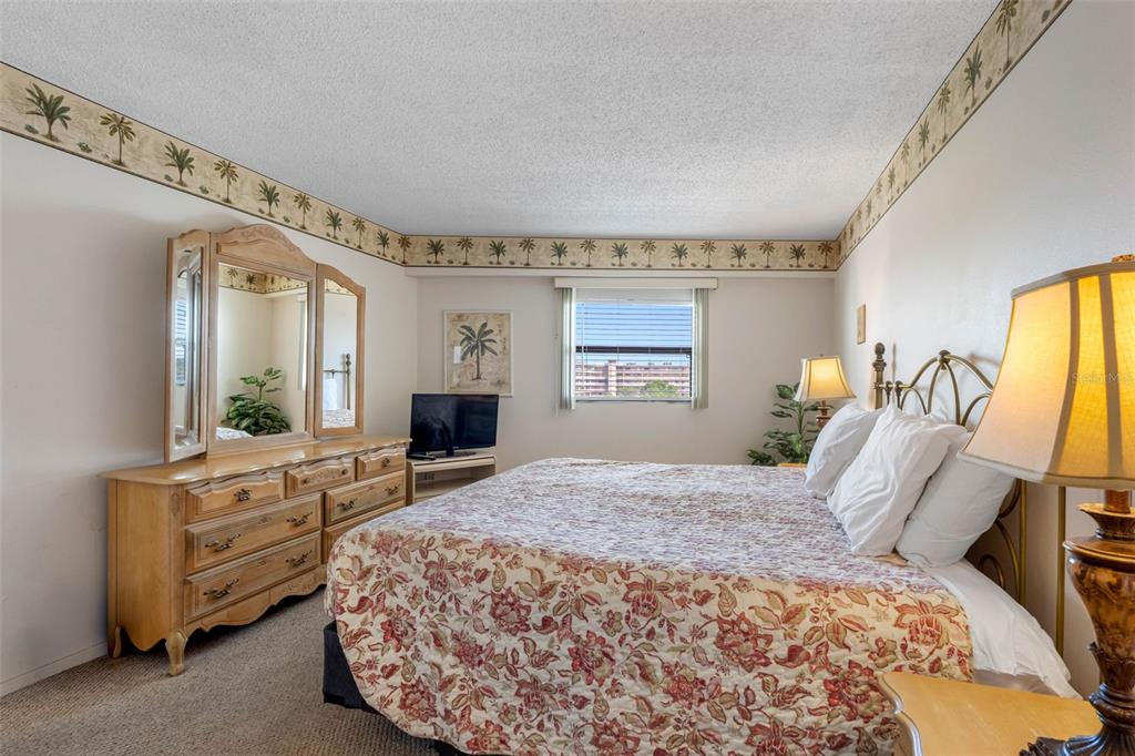 19440 Gulf Boulevard, Unit 506 Indian Rocks Beach, FL 33785 - Photo 57 of 67 a bedroom with a large bed and a window