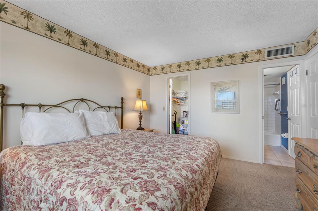 19440 Gulf Boulevard, Unit 506 Indian Rocks Beach, FL 33785 - Photo 59 of 67 a bedroom with a bed and a mirror
