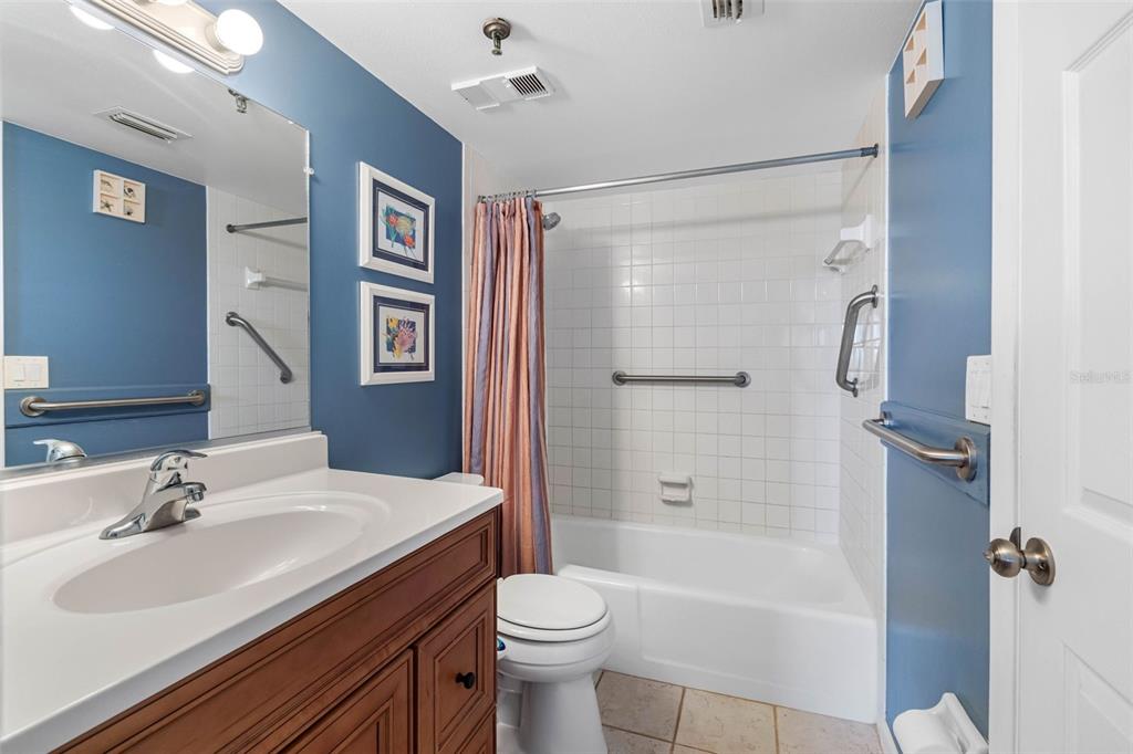 19440 Gulf Boulevard, Unit 506 Indian Rocks Beach, FL 33785 - Photo 65 of 67 a bathroom with a sink a toilet and shower