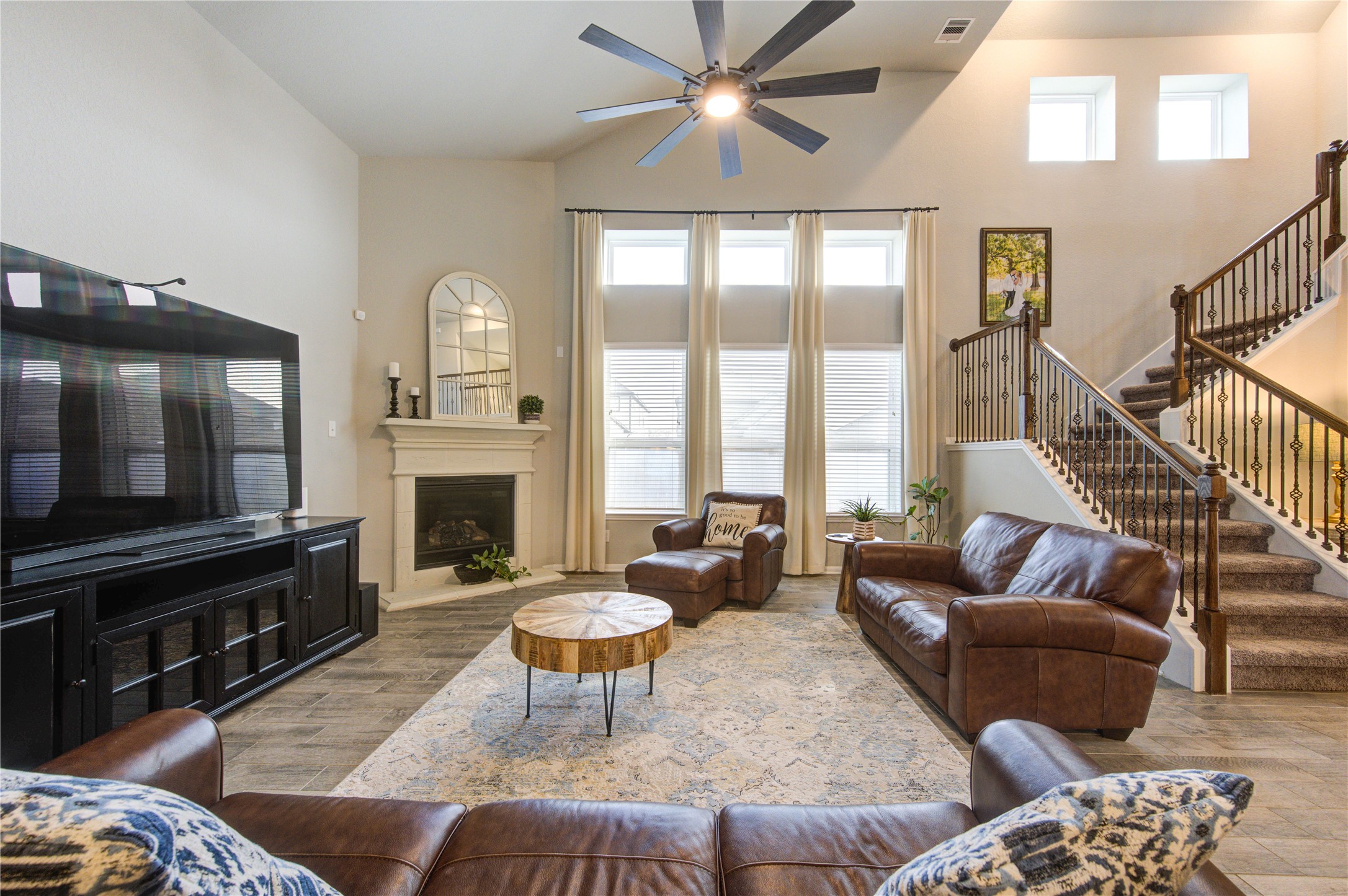 5439 Rustic Ruby Drive Brookshire, TX 77423 - Photo 15 of 43 Welcome to the heart of the home, where comfort meets luxury. This family room boasts soaring ceilings, allowing natural light to flow through the space.