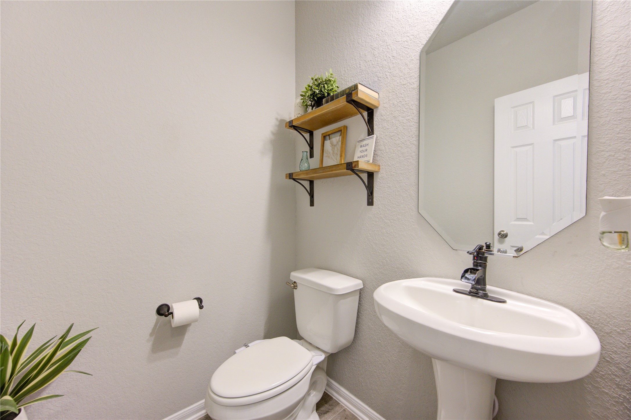 5439 Rustic Ruby Drive Brookshire, TX 77423 - Photo 38 of 43 Half bath perfect for guests to powder their nose during gatherings!