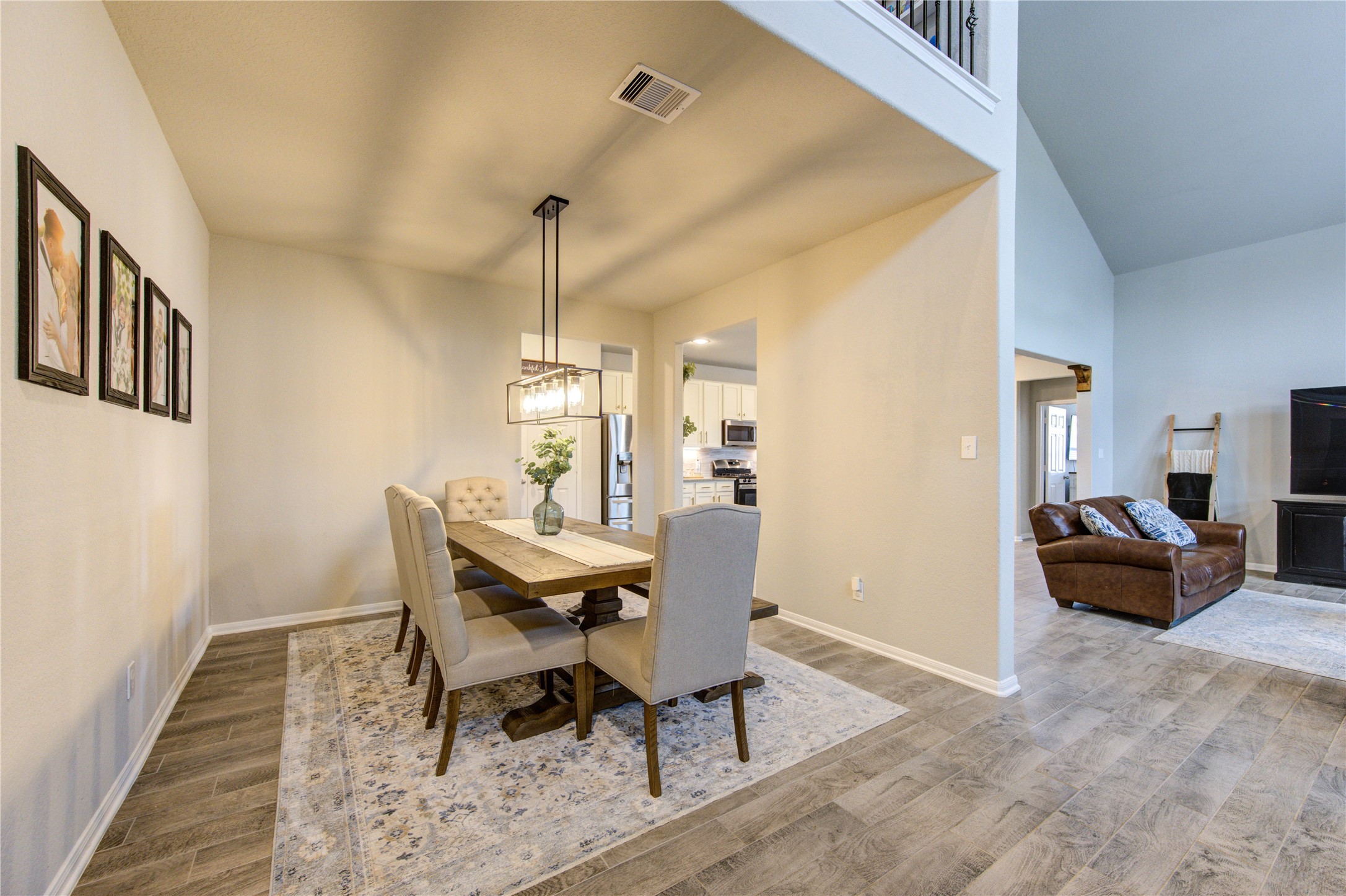 5439 Rustic Ruby Drive Brookshire, TX 77423 - Photo 5 of 43 Every detail, from the high ceiling to the gorgeous chandelier, works together to create a warm, inviting space.