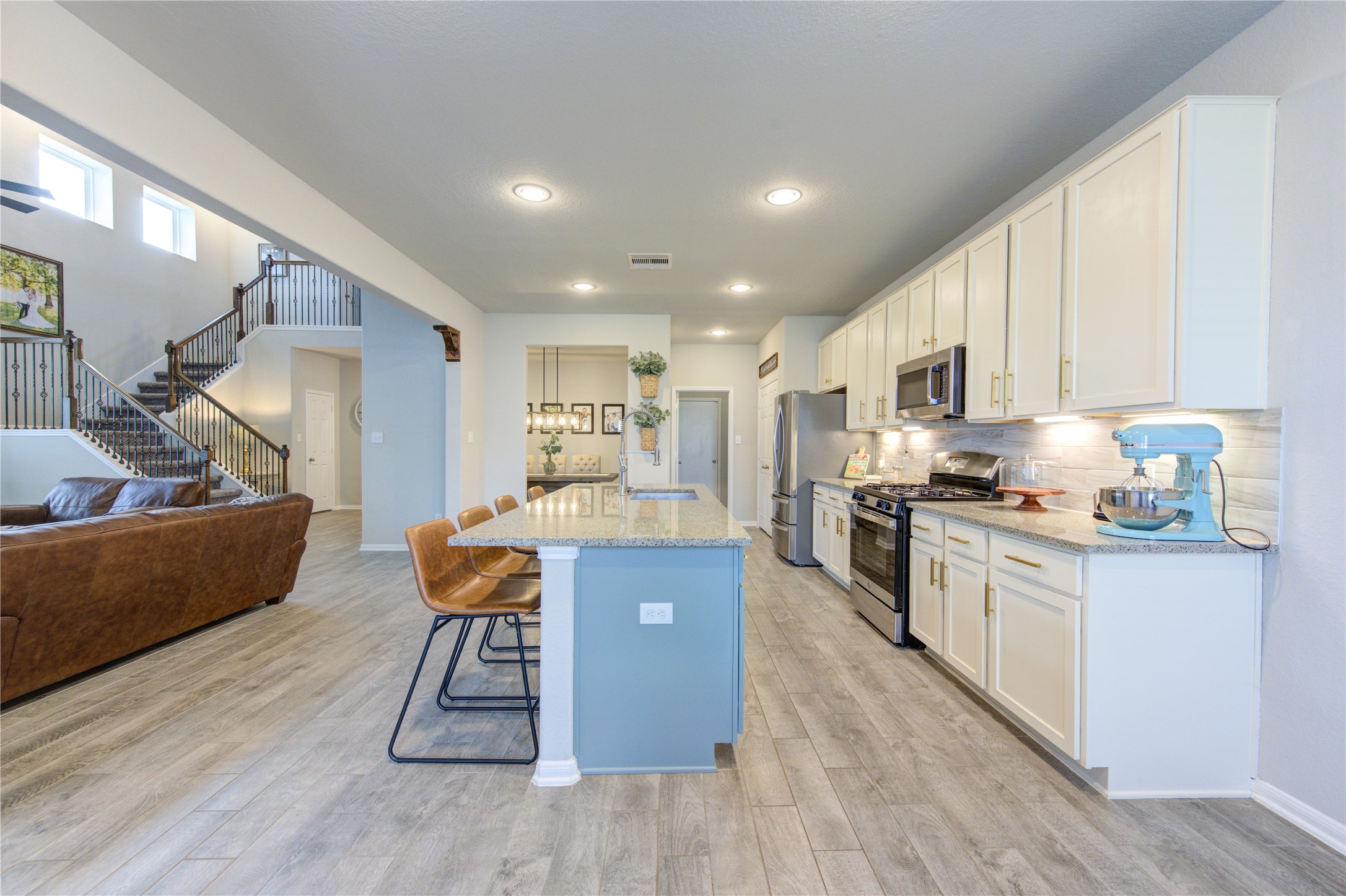 5439 Rustic Ruby Drive Brookshire, TX 77423 - Photo 9 of 43 Cooking is a breeze with loads of prep space and an amazing layout. A tile backsplash and complementary granite countertops give a cohesive feel in this gourmet kitchen.