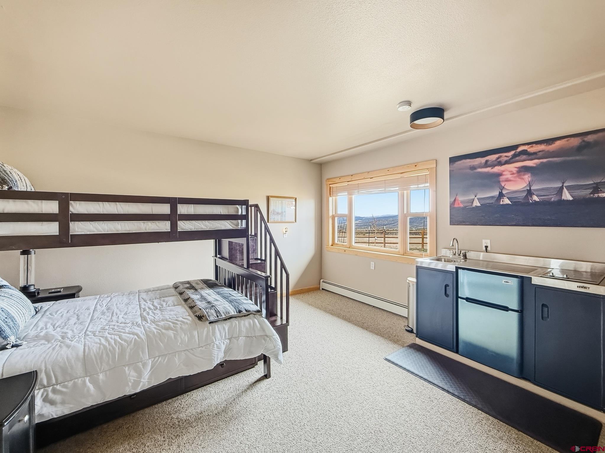 1190 7745 Road Crawford, CO 81415 - Photo 33 of 43 a bedroom with a large bed and a large window