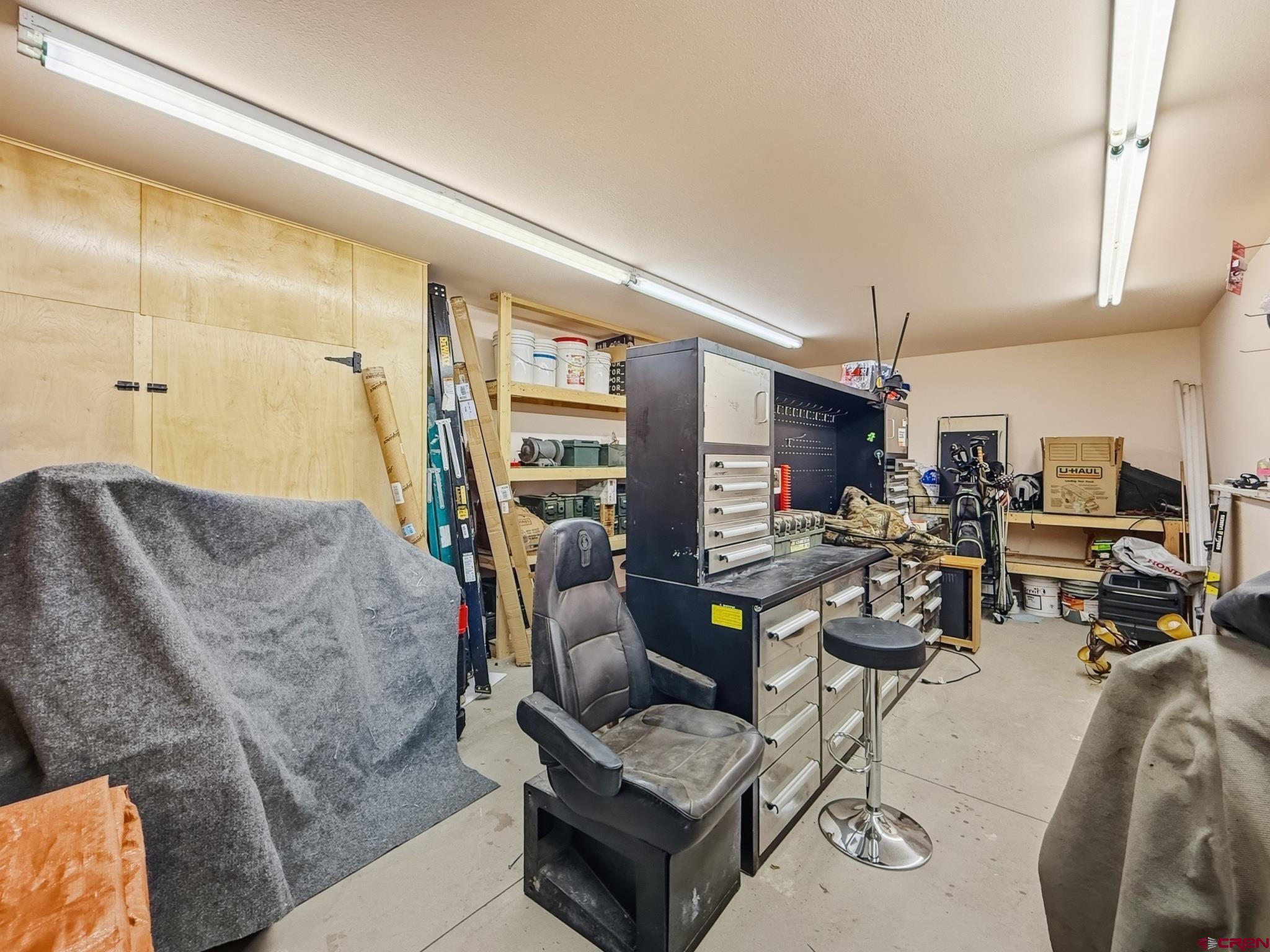 1190 7745 Road Crawford, CO 81415 - Photo 35 of 43 a living room with furniture and a fireplace