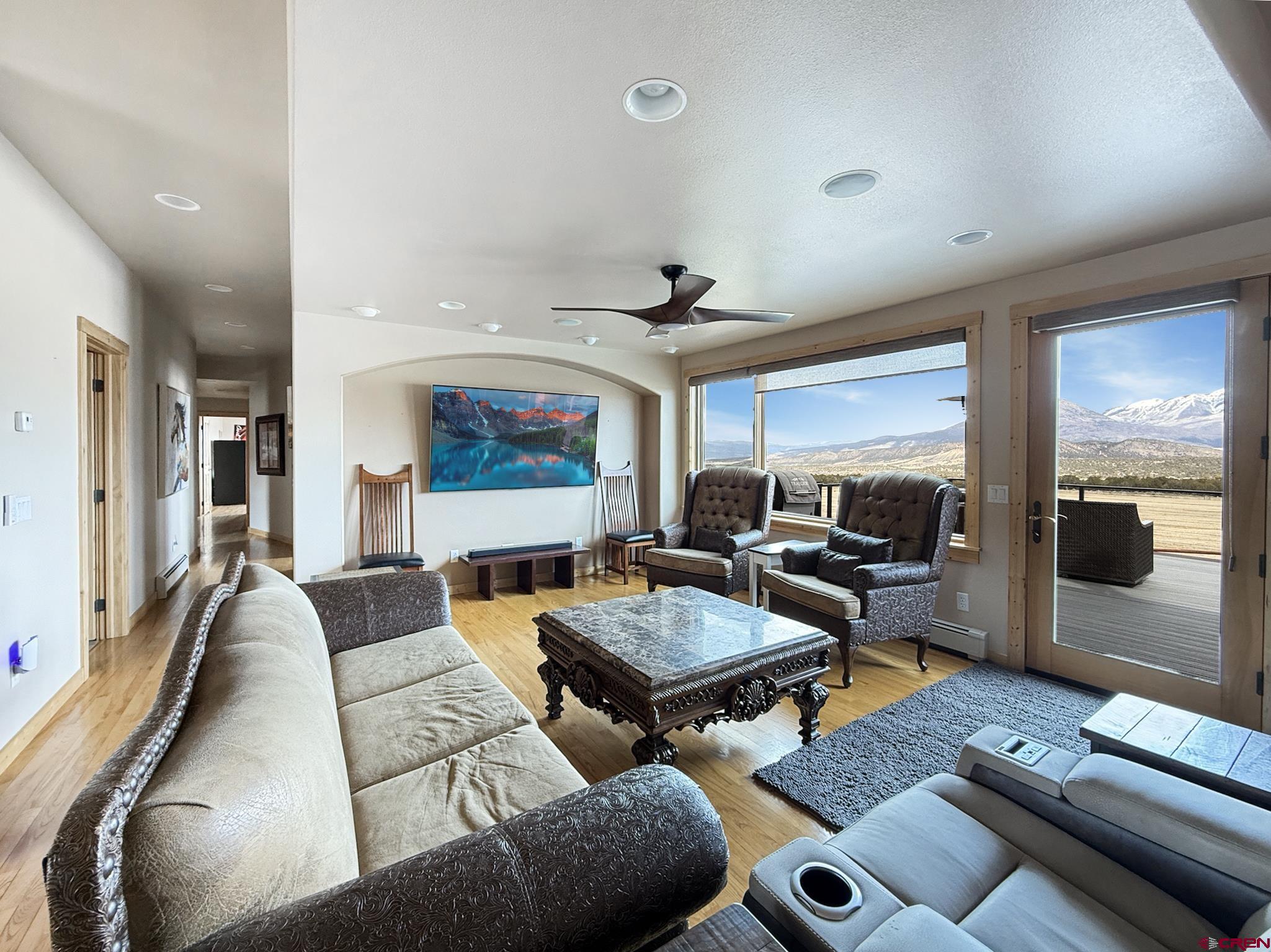 1190 7745 Road Crawford, CO 81415 - Photo 10 of 43 a living room with furniture and a flat screen tv