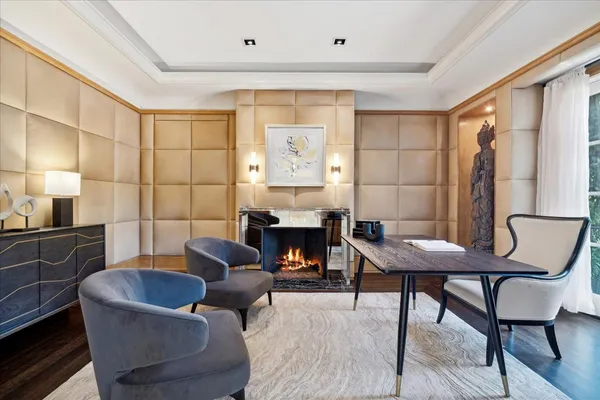 a living room with furniture and a chandelier