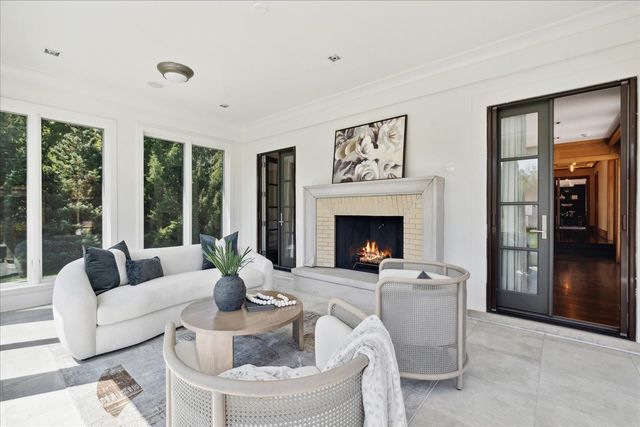 a view of an empty room with stairs and a window