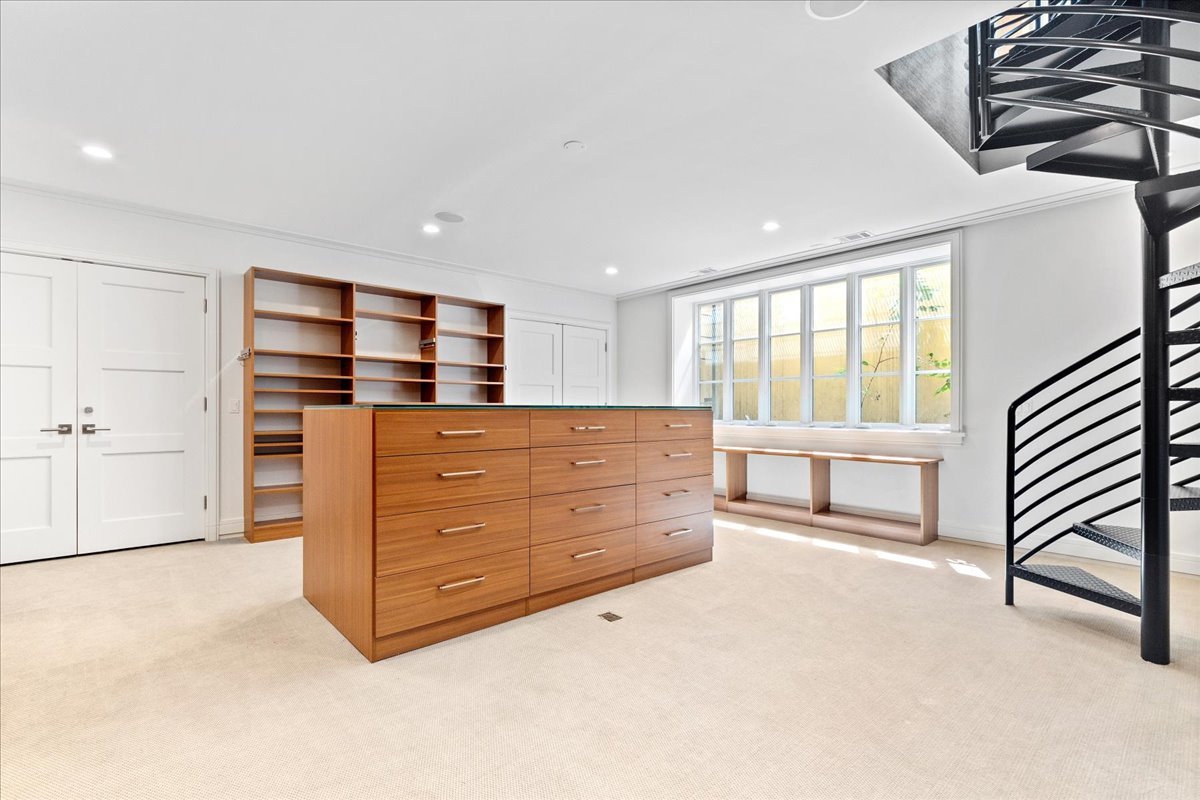 261 East Onwentsia Road Lake Forest, IL 60045 - Photo 26 of 65 a room with a dresser and a window