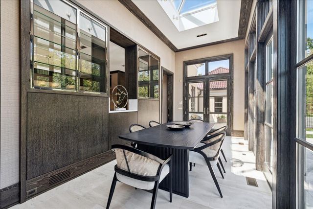 a bedroom with a bed a couch and a window