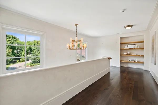 a front view of a house with a yard table and chairs