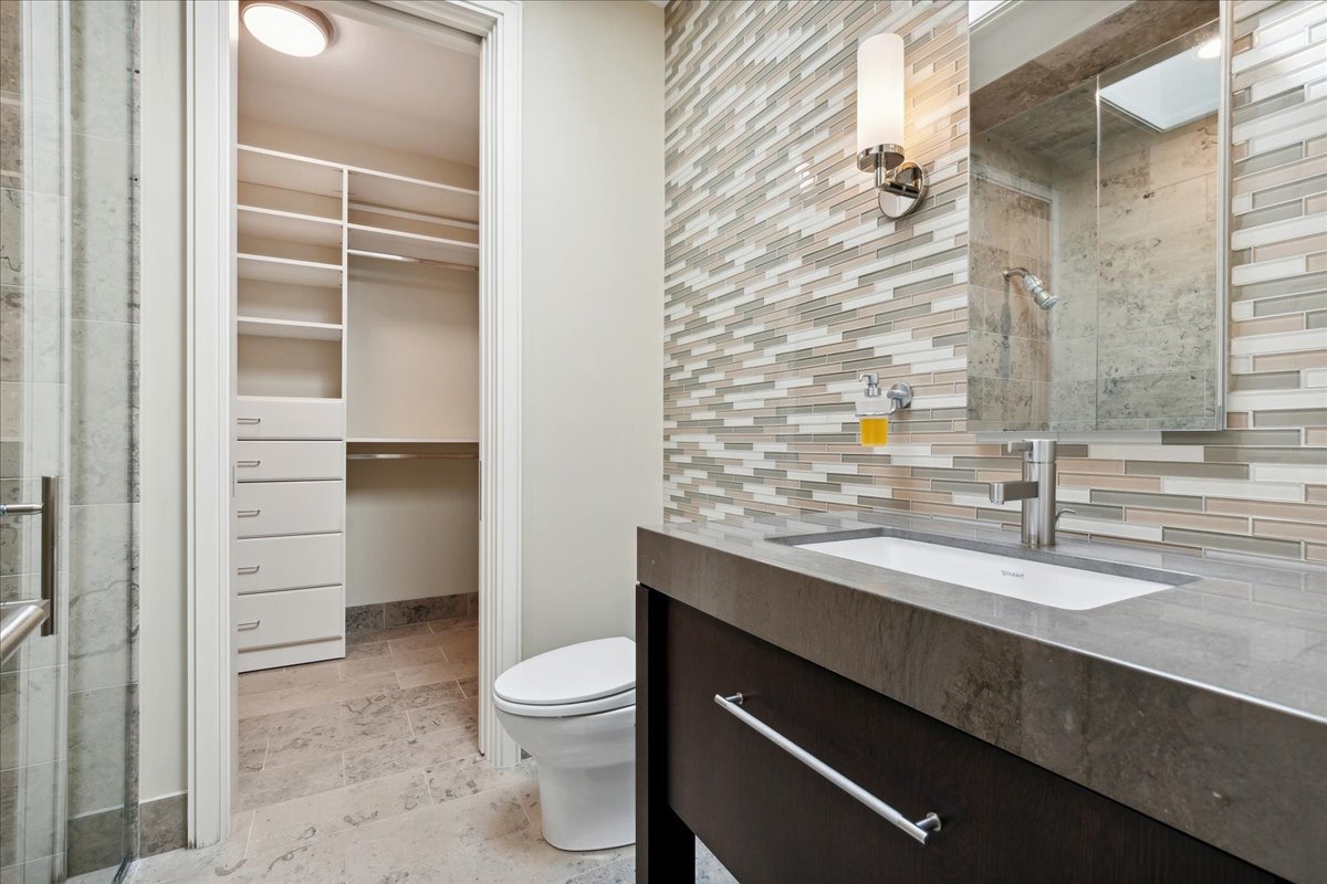 261 East Onwentsia Road Lake Forest, IL 60045 - Photo 49 of 65 a bathroom with a sink a toilet and shower