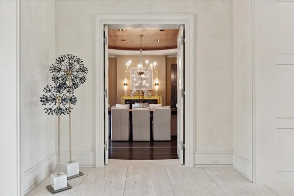 a living room with furniture a fireplace and a large window