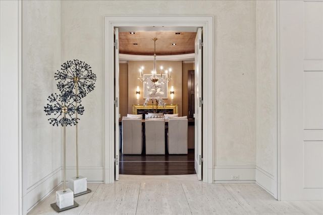 a living room with furniture a fireplace and a large window