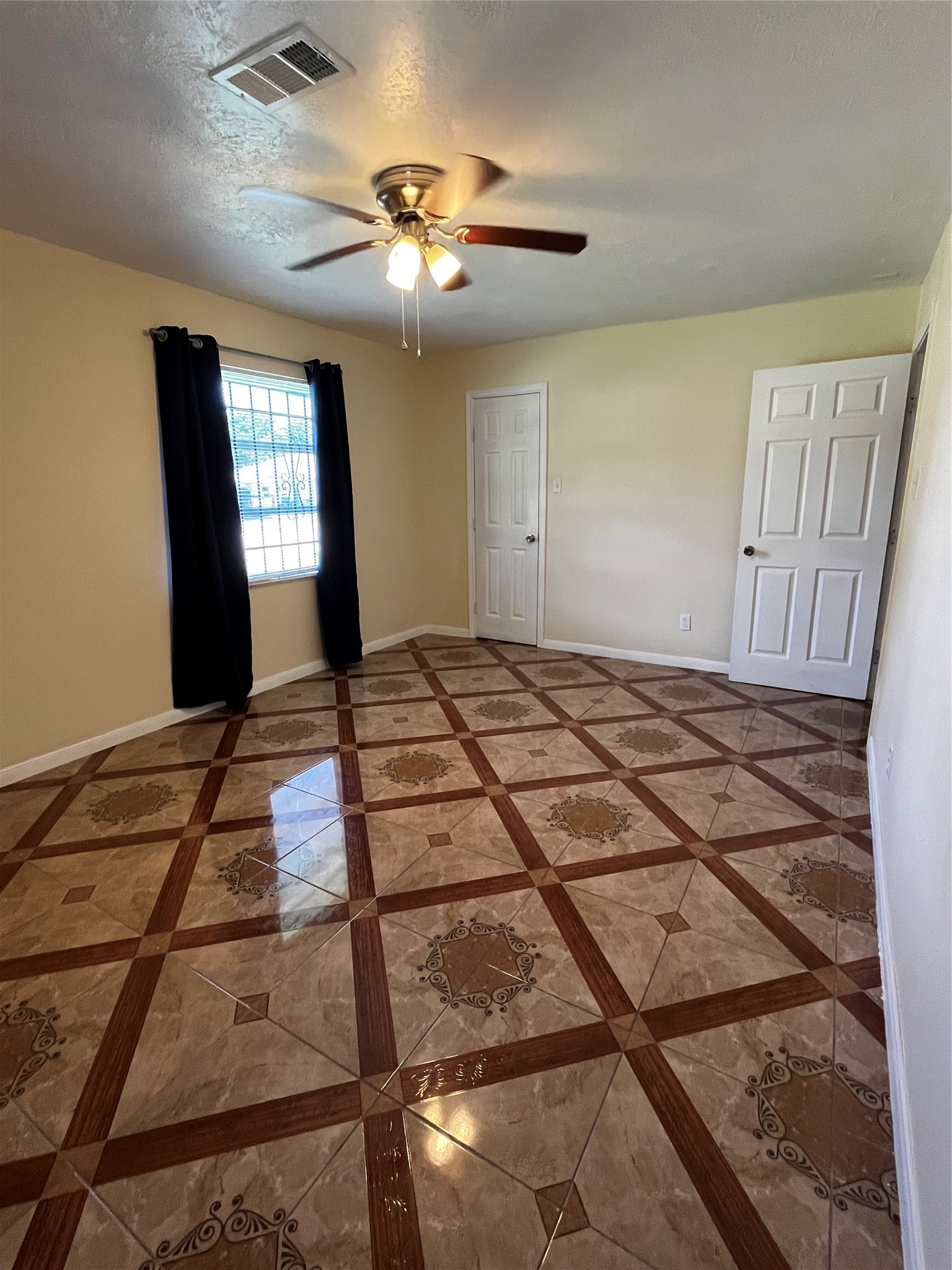 3163 Roe Drive Houston, TX 77087 - Photo 43 of 47 a bedroom with a bed and a chandelier