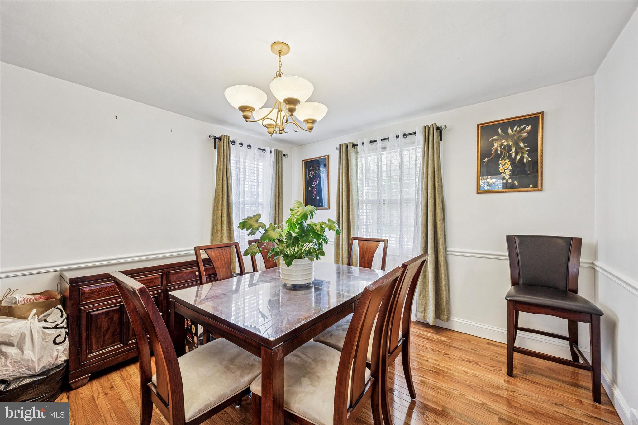 306 East Springfield Road Springfield, PA 19064 - Photo 12 of 40 a view of a dining room with furniture and wooden floor