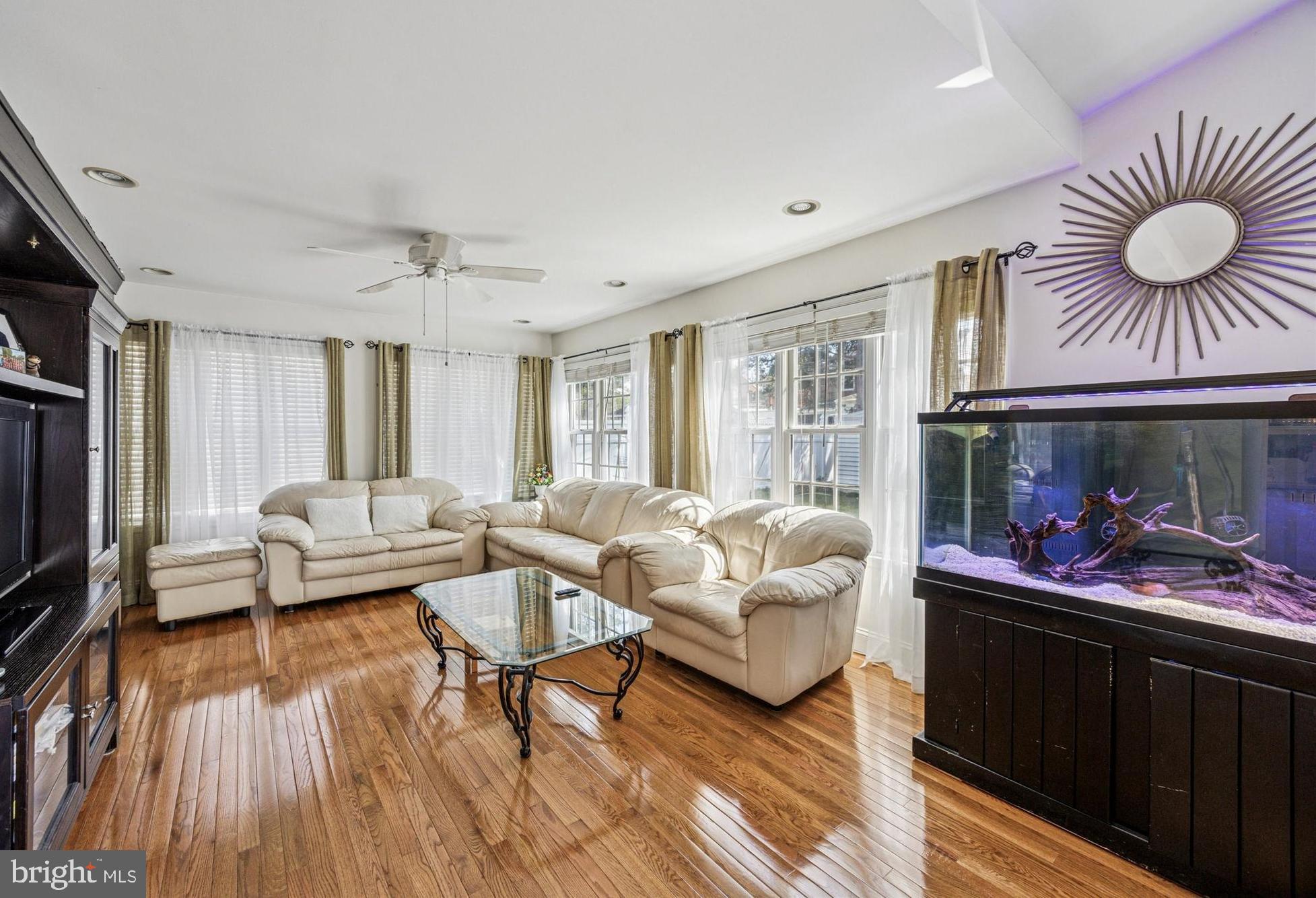 306 East Springfield Road Springfield, PA 19064 - Photo 13 of 40 a living room with furniture a fireplace and a flat screen tv