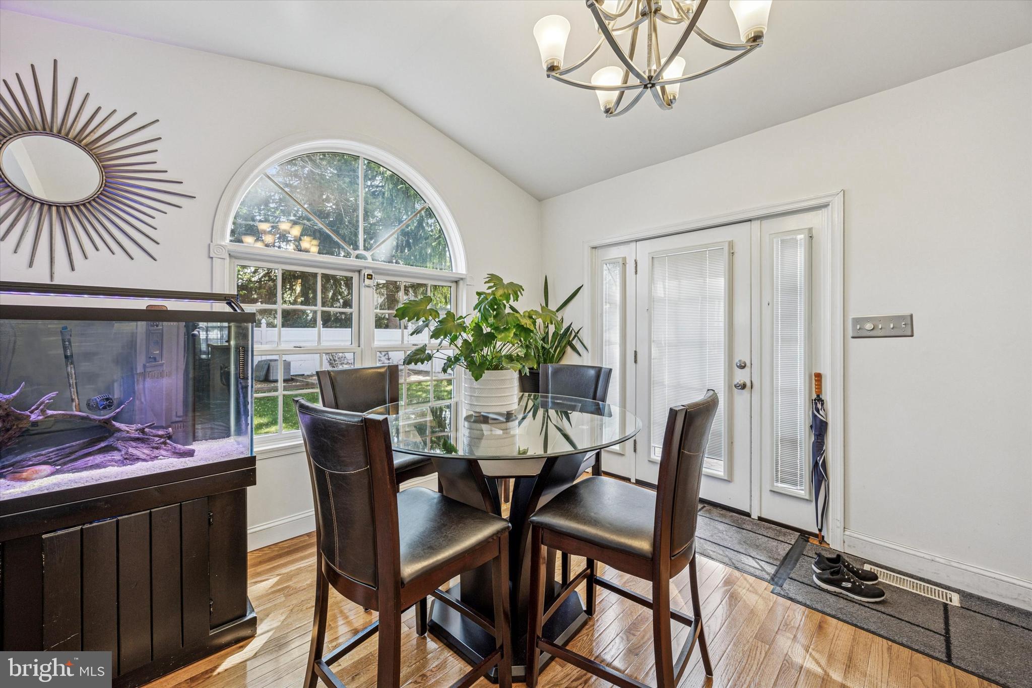 306 East Springfield Road Springfield, PA 19064 - Photo 15 of 40 a view of a dining room with furniture window and wooden floor