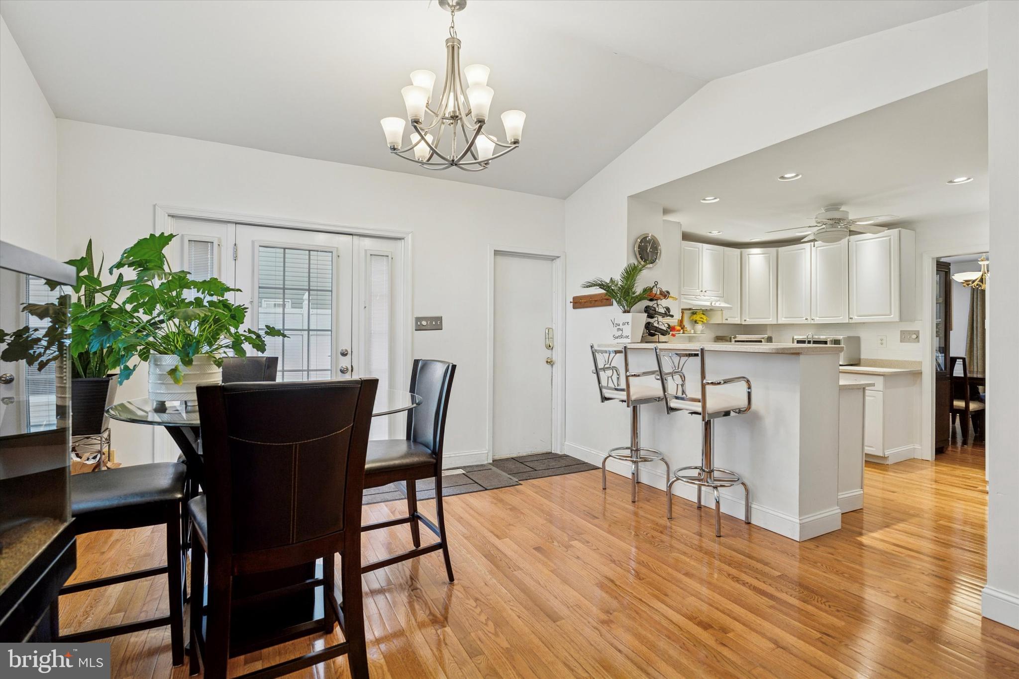 306 East Springfield Road Springfield, PA 19064 - Photo 17 of 40 a view of a dining room with furniture and wooden floor