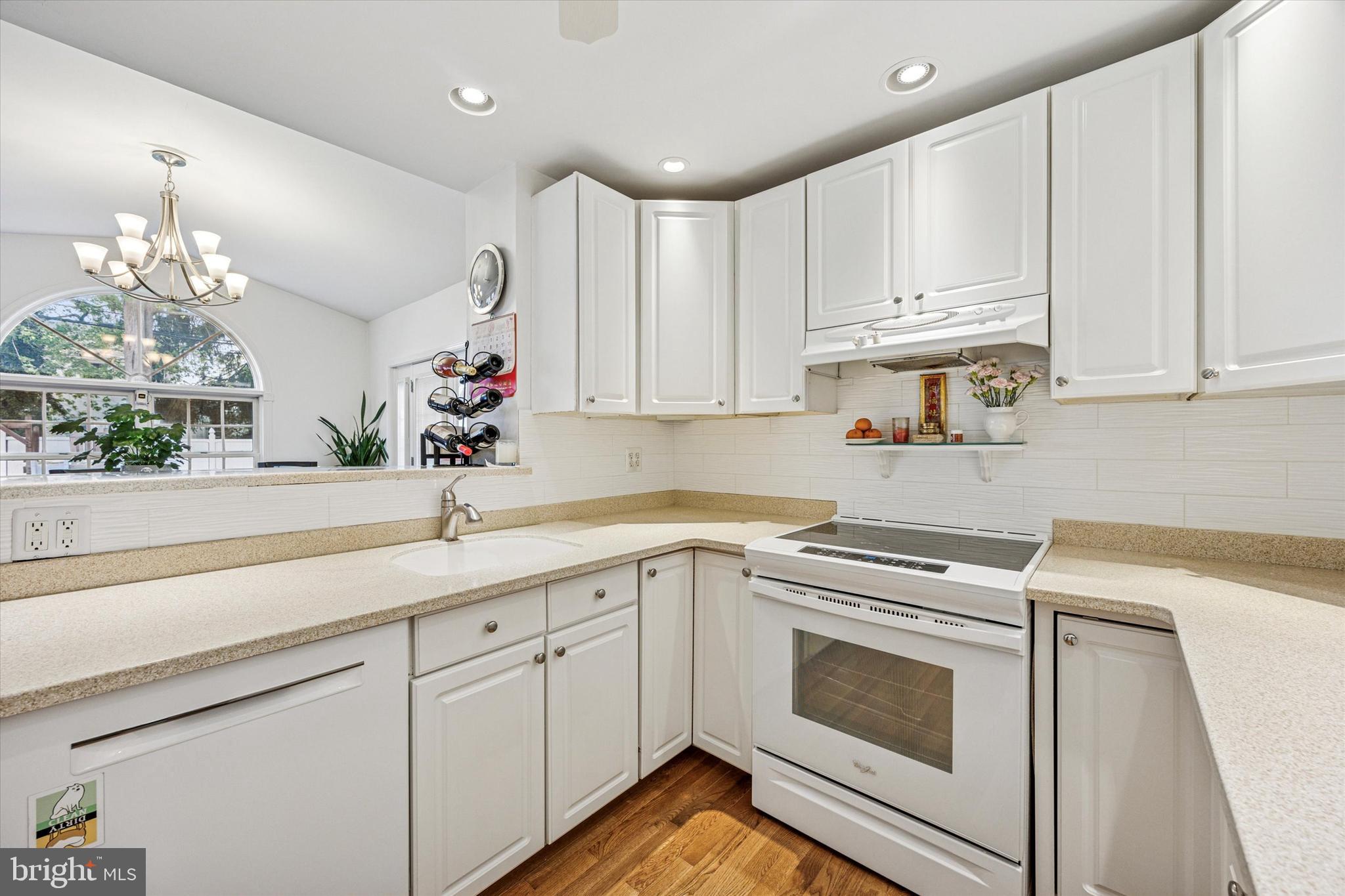 306 East Springfield Road Springfield, PA 19064 - Photo 22 of 40 a kitchen with a white cabinets and white appliances