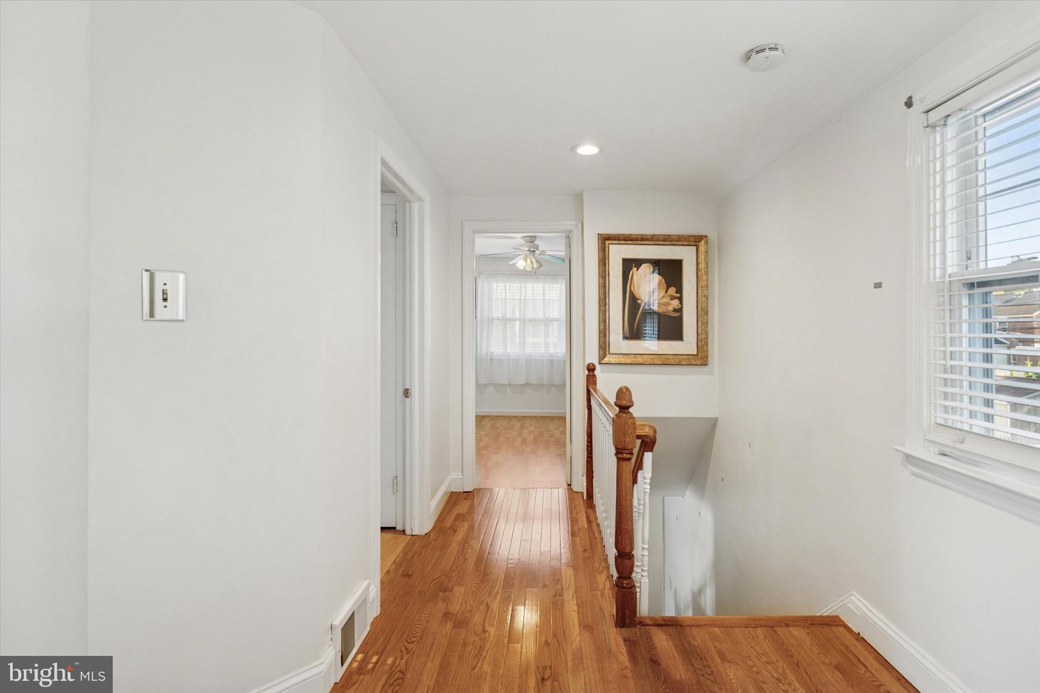 306 East Springfield Road Springfield, PA 19064 - Photo 23 of 40 a view of hallway with wooden floor and stairs