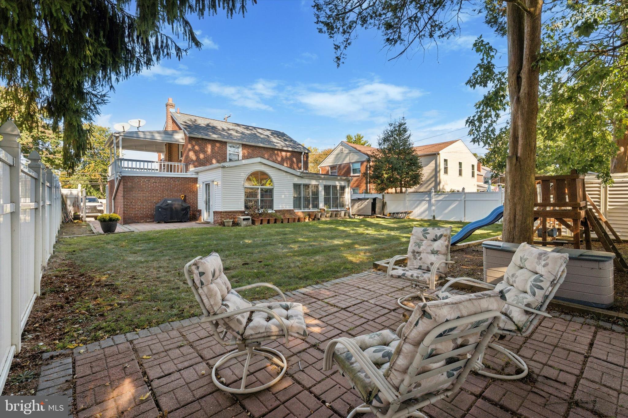 306 East Springfield Road Springfield, PA 19064 - Photo 37 of 40 a view of a house with backyard sitting area and garden