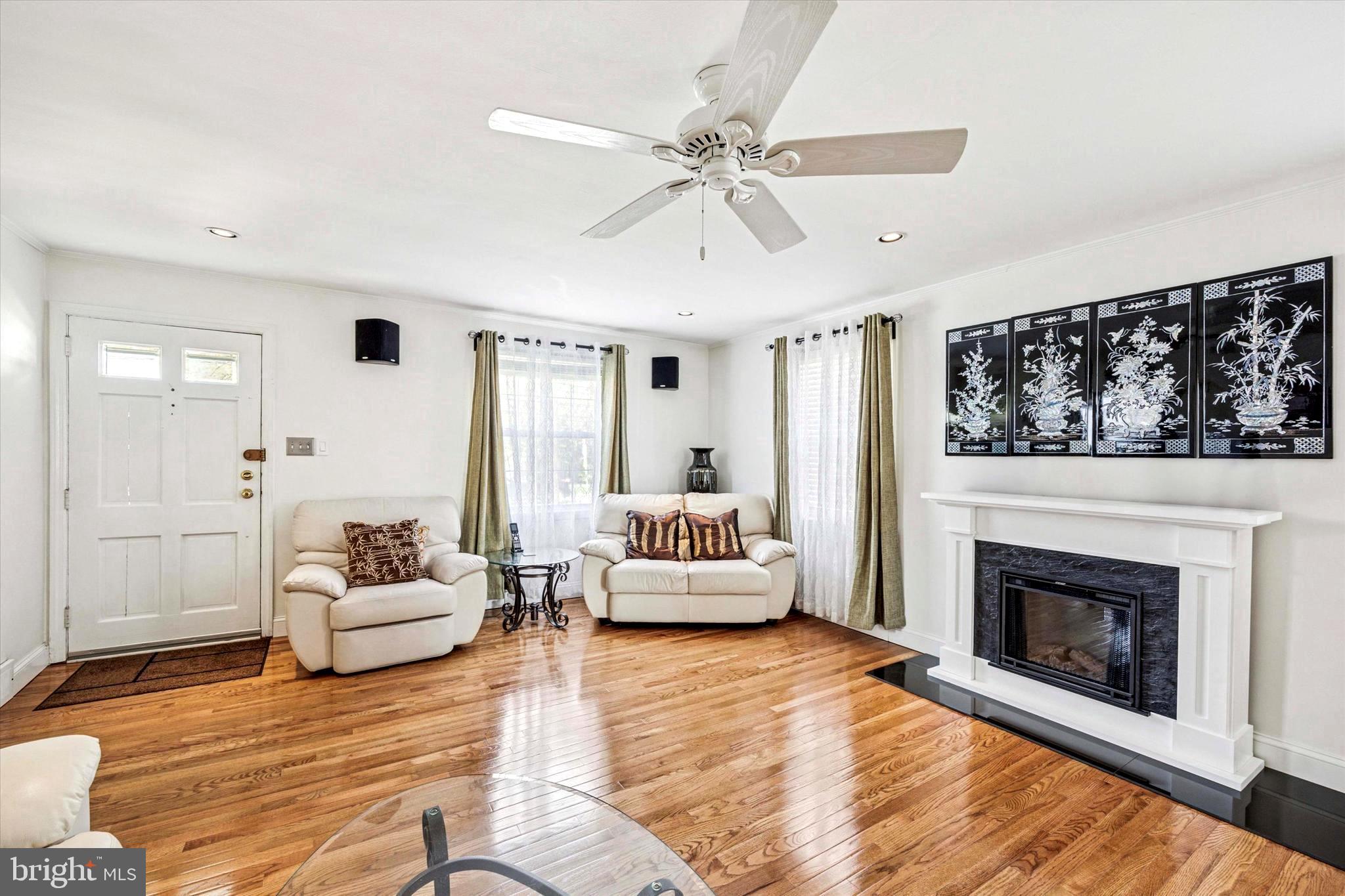 306 East Springfield Road Springfield, PA 19064 - Photo 9 of 40 a living room with furniture and a fireplace