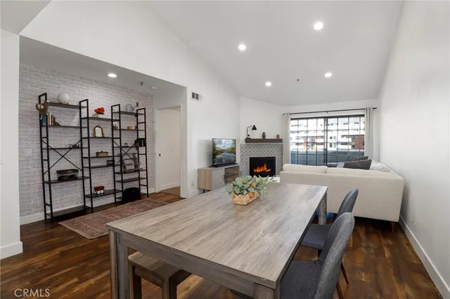 a view of a room with furniture and wooden floor