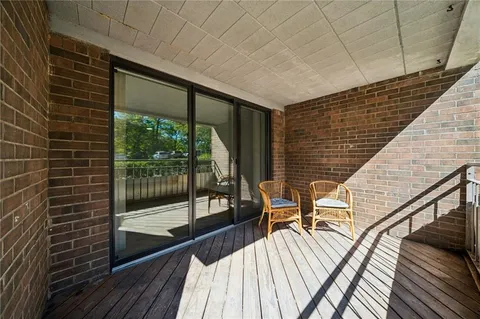 a view of a balcony with furniture