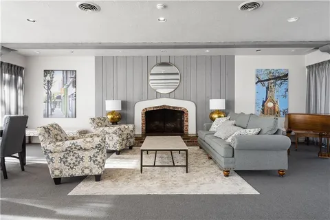 a dining room with a wooden table and chairs