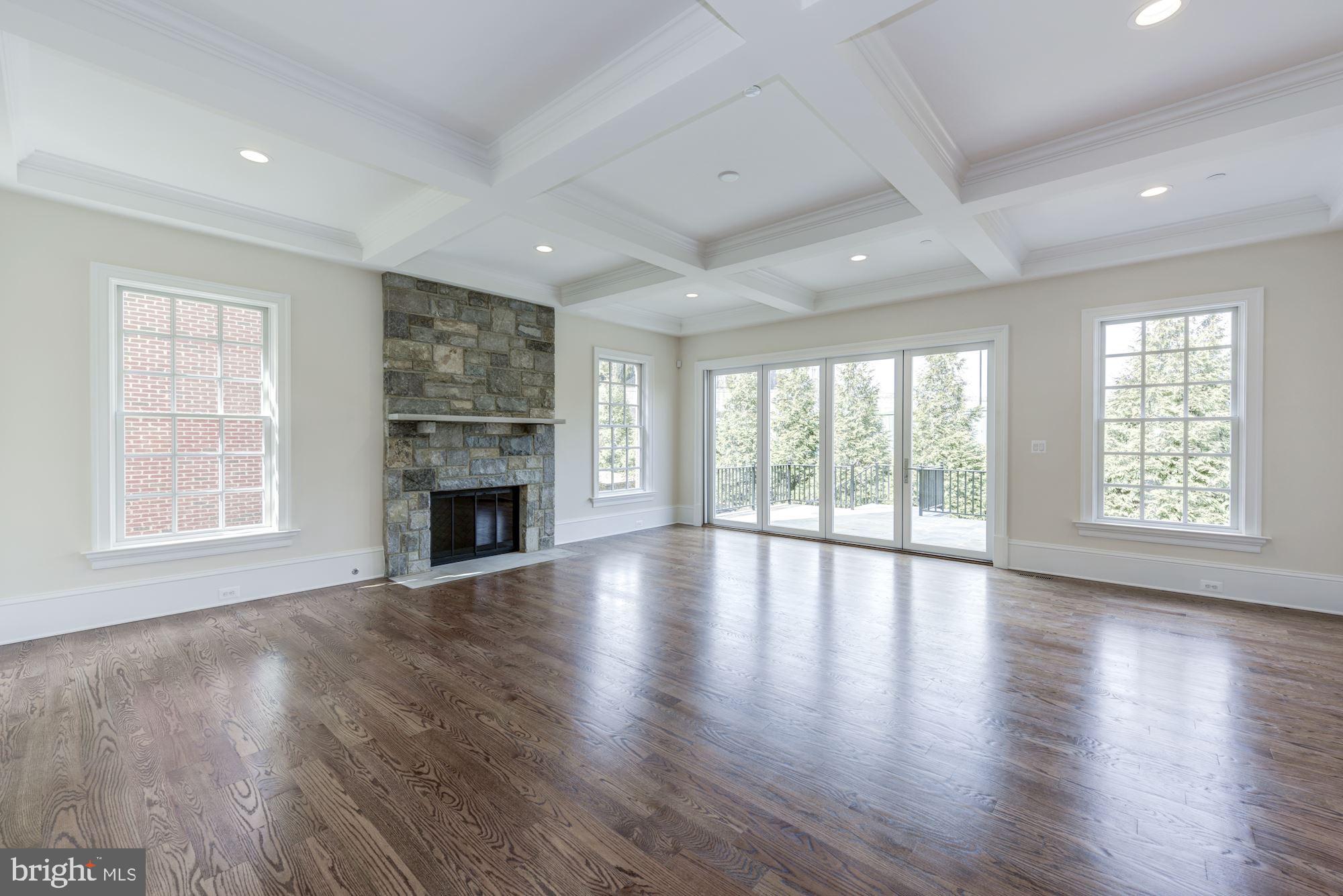 4513 Hoban Road Northwest Washington, DC 20007 - Photo 12 of 29 a view of an empty room with wooden floor and a window