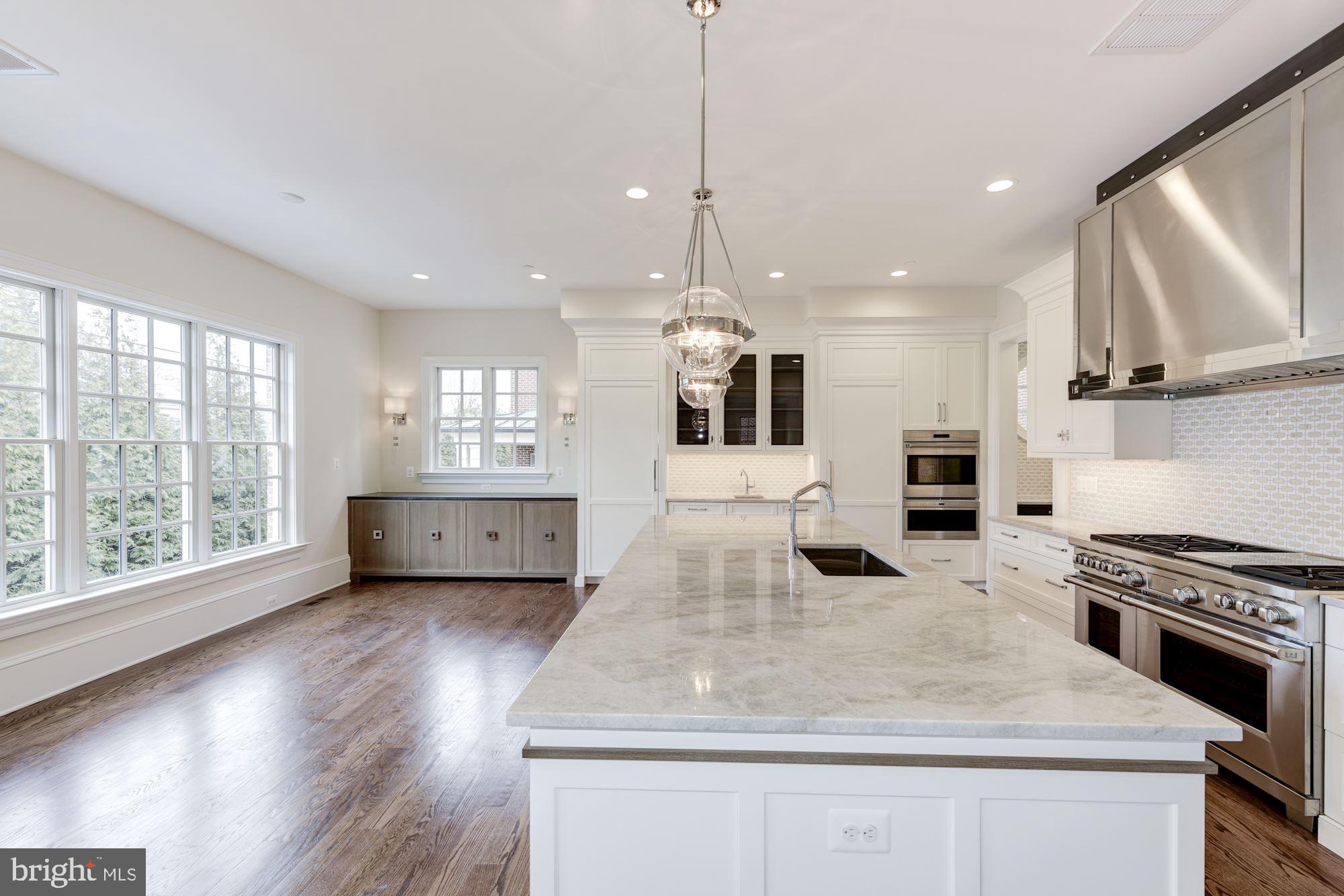 4513 Hoban Road Northwest Washington, DC 20007 - Photo 14 of 29 a kitchen with stainless steel appliances granite countertop a stove a sink and a refrigerator