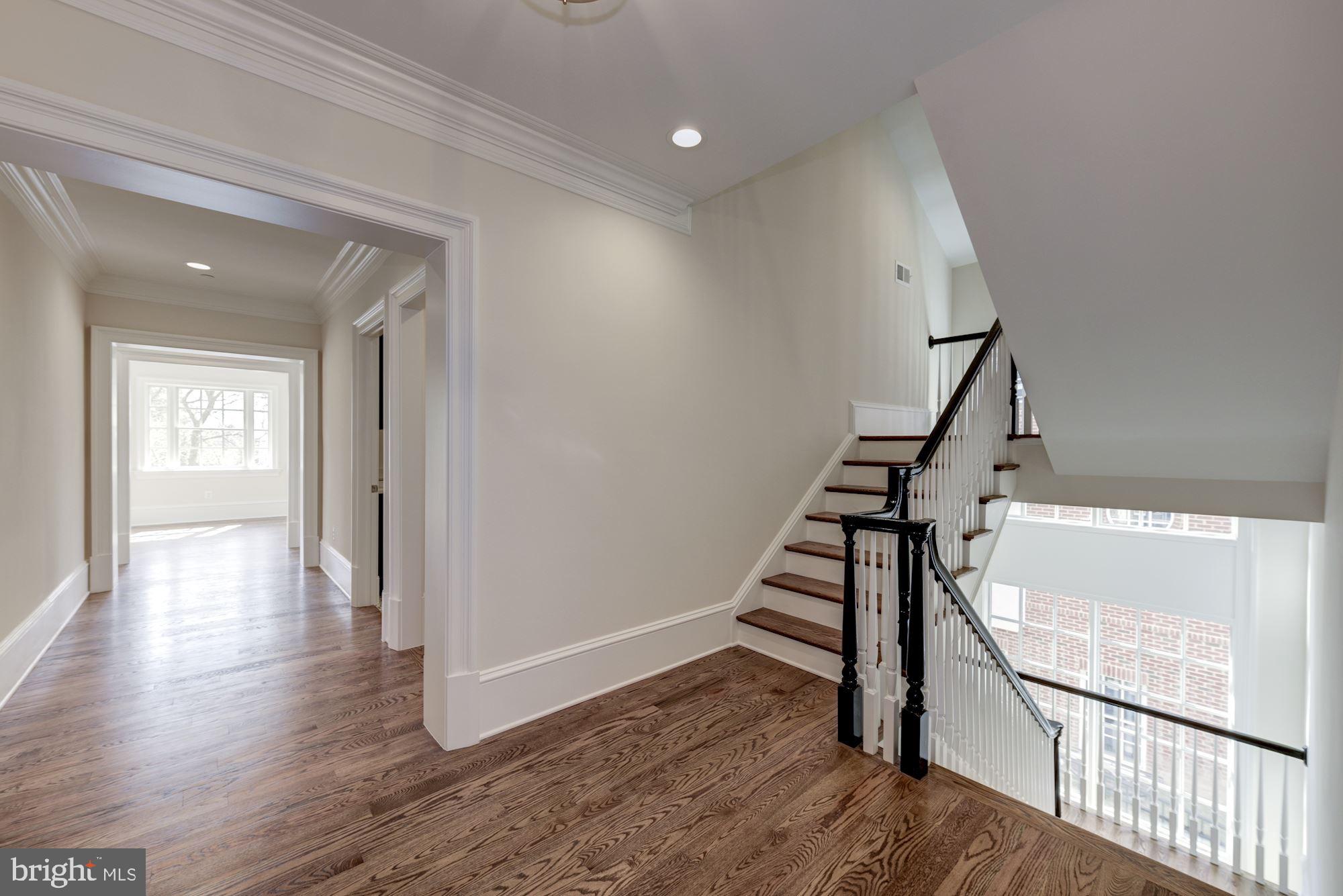 4513 Hoban Road Northwest Washington, DC 20007 - Photo 21 of 29 a view of entryway with wooden floor and stairs