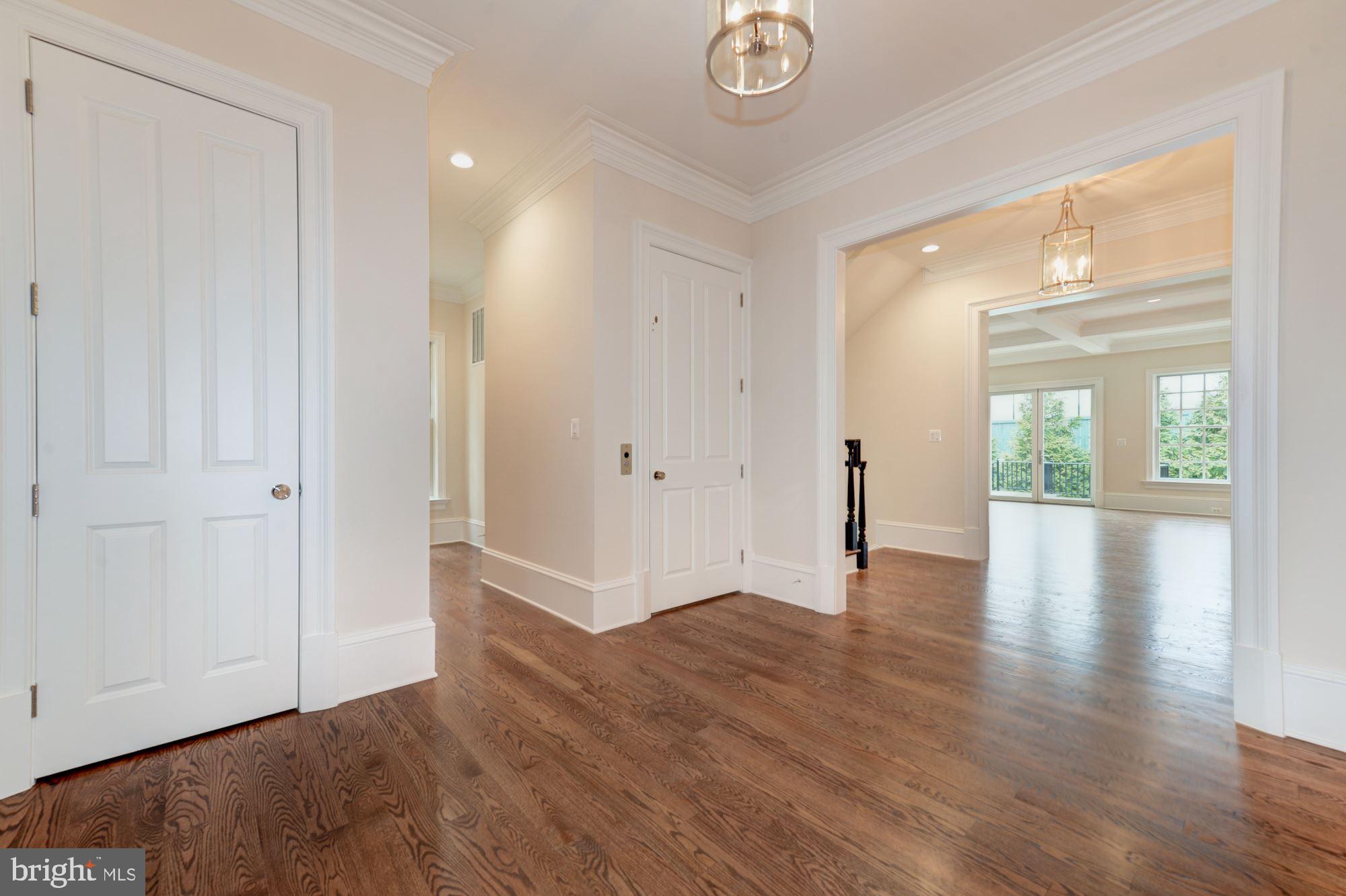 4513 Hoban Road Northwest Washington, DC 20007 - Photo 7 of 29 a view of an empty room with wooden floor and a window