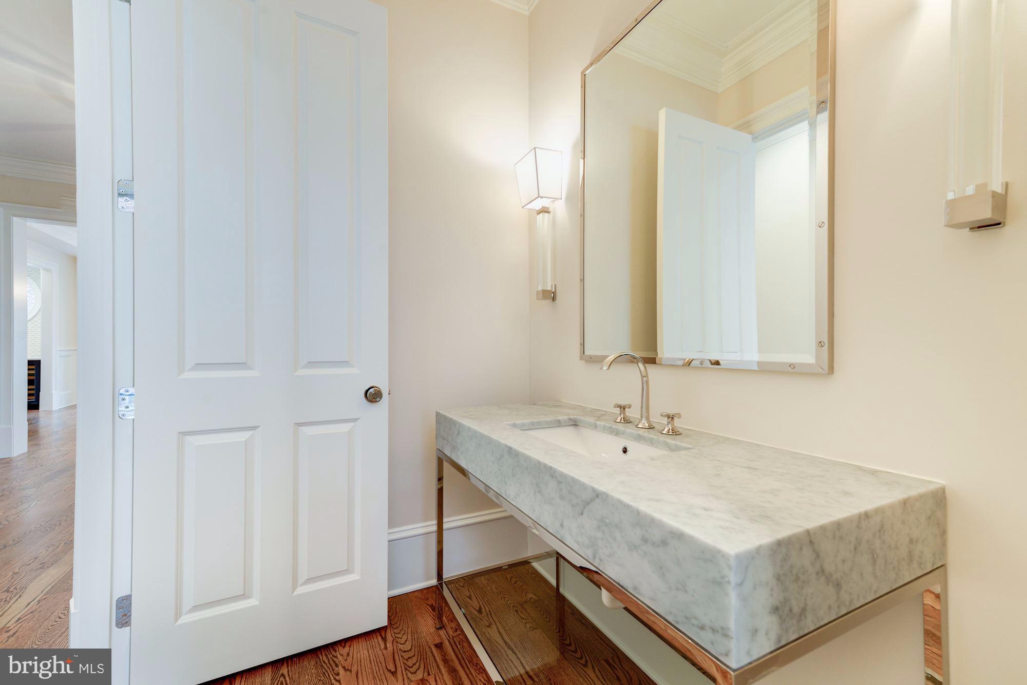 4513 Hoban Road Northwest Washington, DC 20007 - Photo 8 of 29 a bathroom with a sink and a mirror