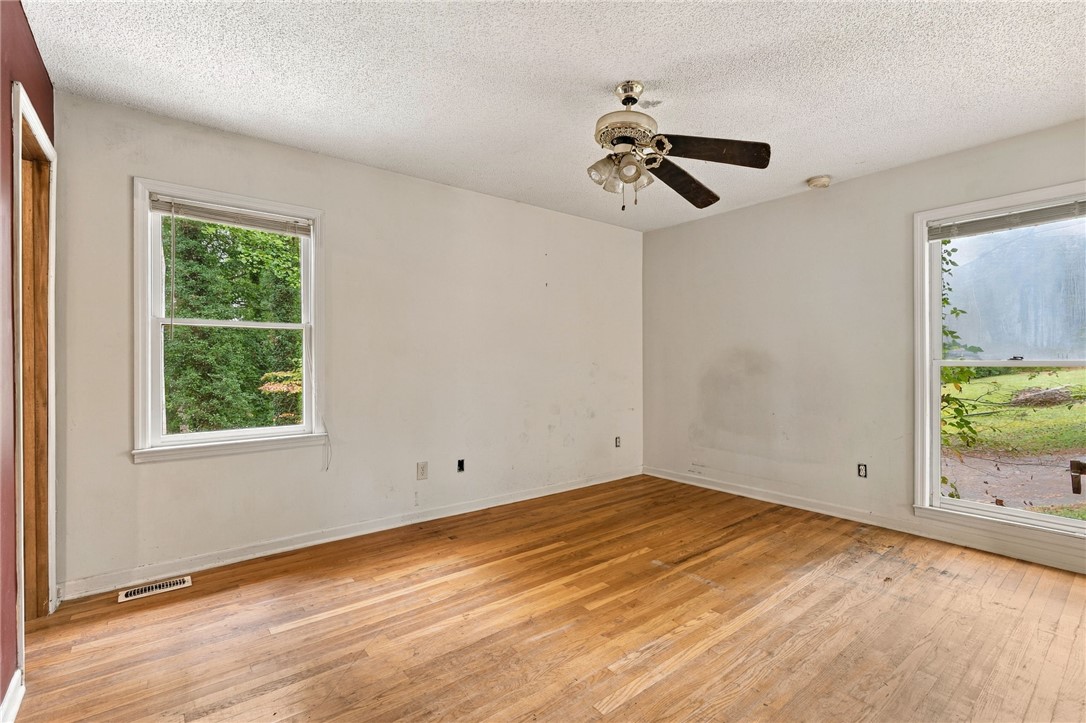 133 Pinetree Lane Easley, SC 29640 - Photo 26 of 28 Hardwood floors and natural light from dual windows define this versatile space.