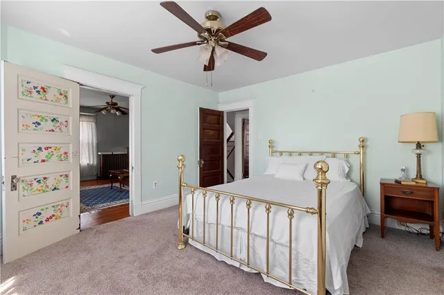 a bedroom with a bed and a walk in closet